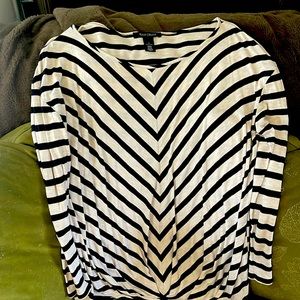 Very soft lightweight , with a little gathering at bottom